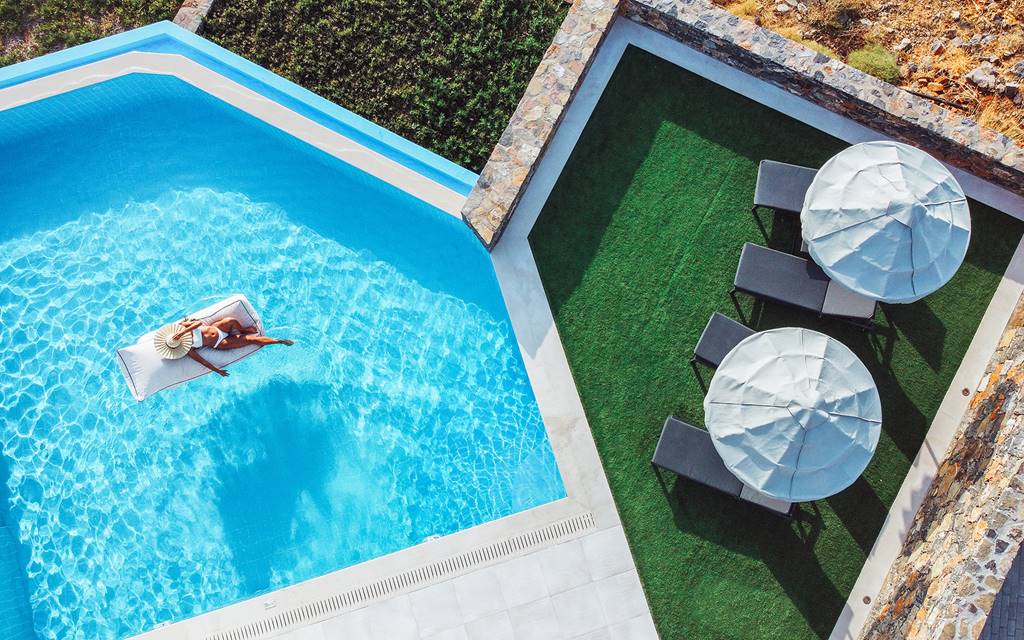 elounda-palm-girl-on-a-pool-float-panoramic elounda-palm-girl-on-a-pool-float-panoramic